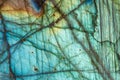 Labradorite rock slab with detailed internal cracks and iridescent effect. LabradorescenceÃÂ in labdradorite mineral stone Royalty Free Stock Photo